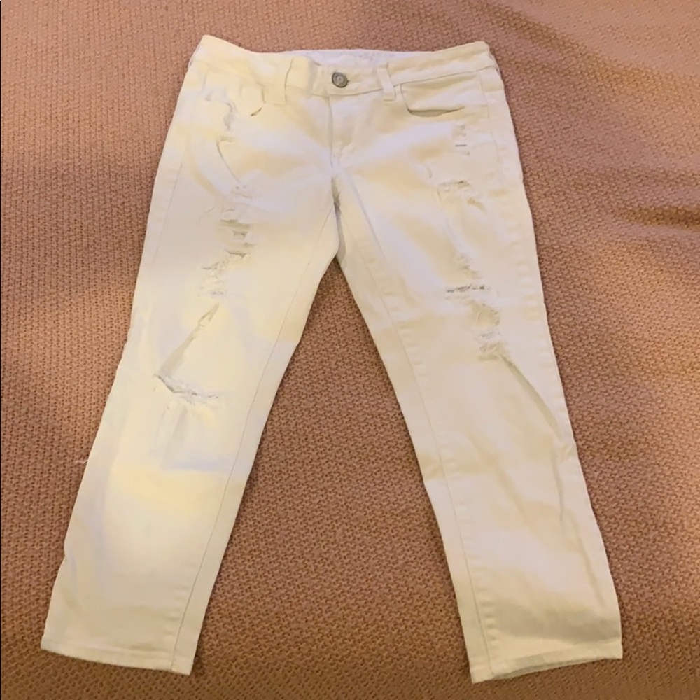 white, ripped jegging fit pants
